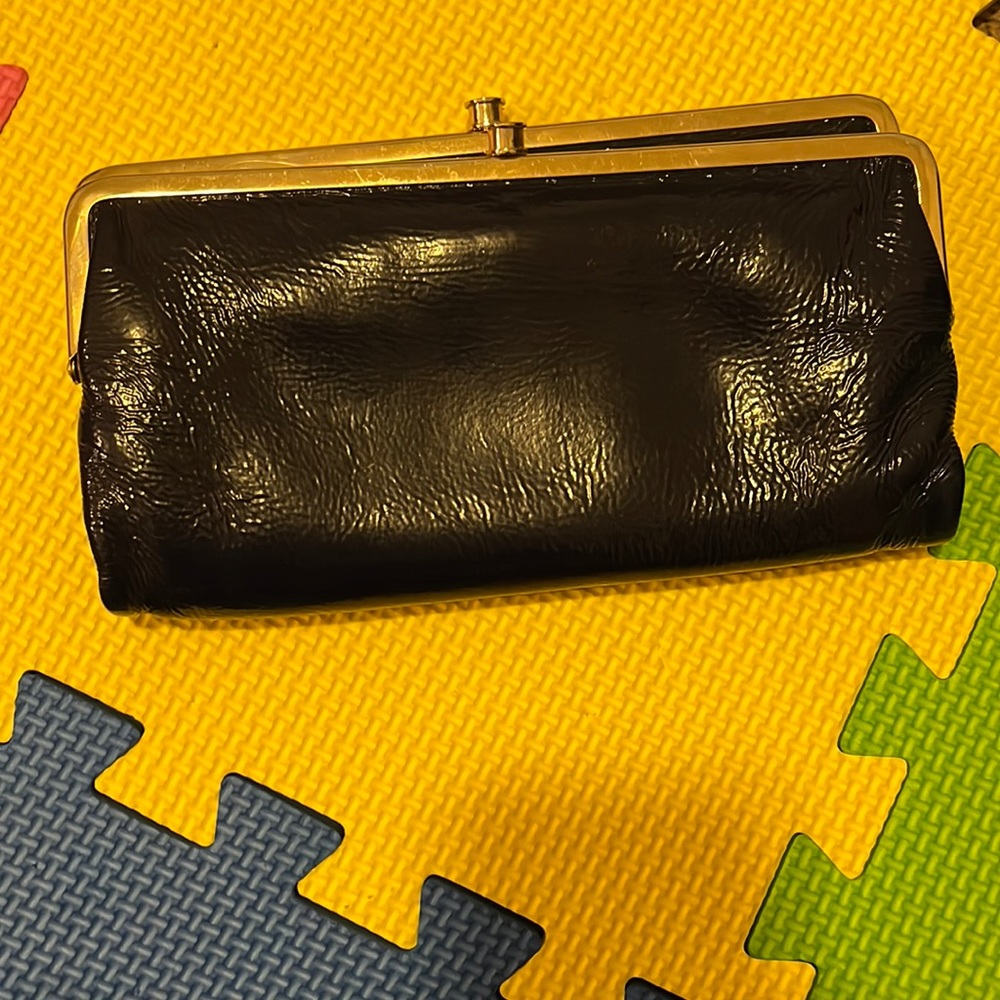 Hobo international, shiny blue leather wallet. With several storage compartments